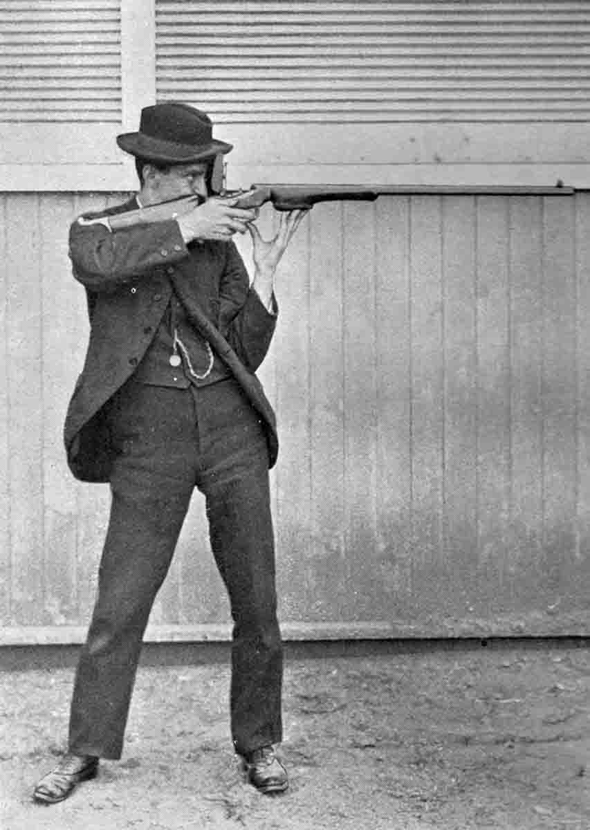 Dr. Walter G. Hudson, expert offhand rifle shot, demonstrating his offhand position. Note the blocked forearm to facilitate a hip-rest position without using a palm rest. From Modern Rifle Shooting by W.G. Hudson, M.D.